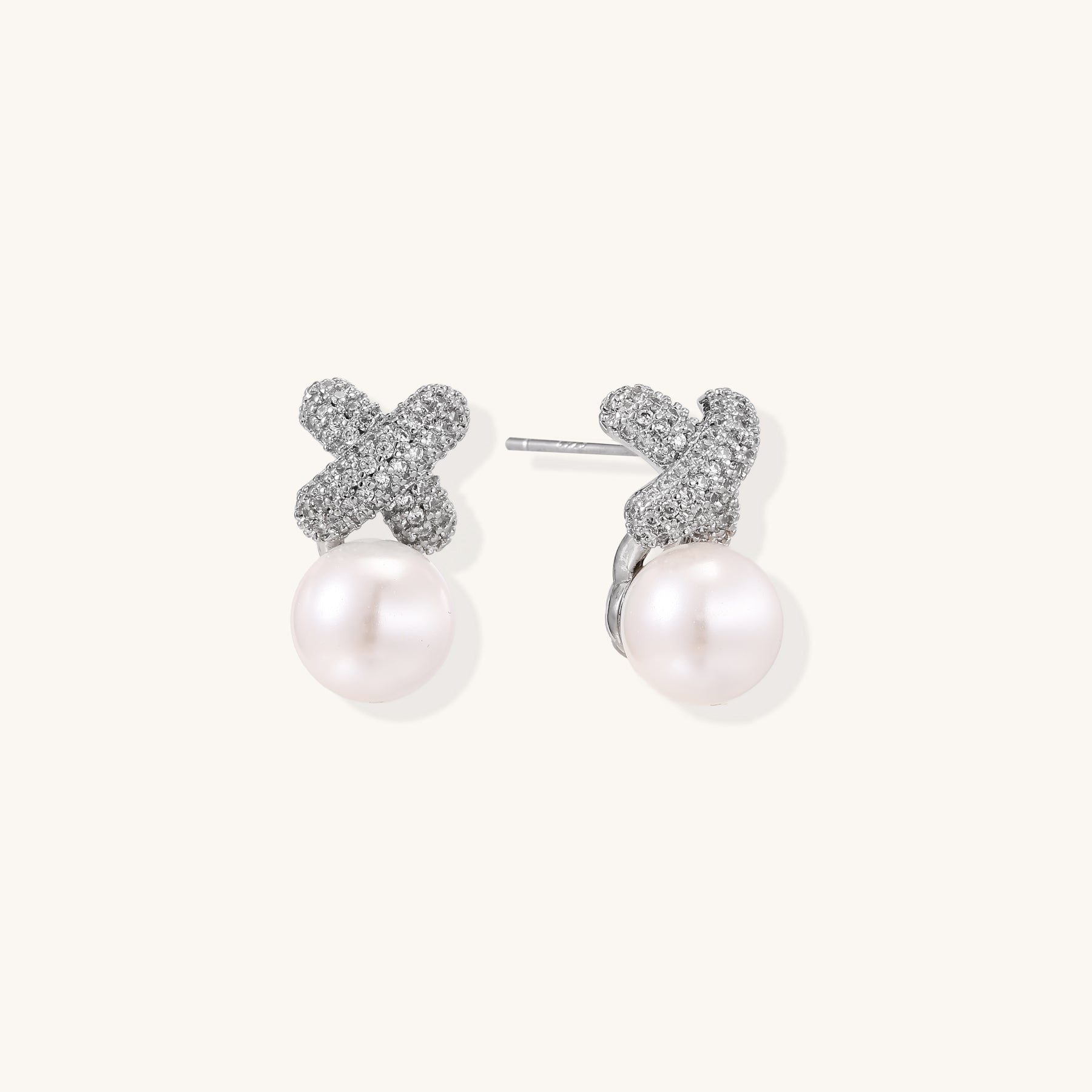 Elegant drop earrings with pavé crystal cross tops and round freshwater pearls on 14K gold plated brass setting.