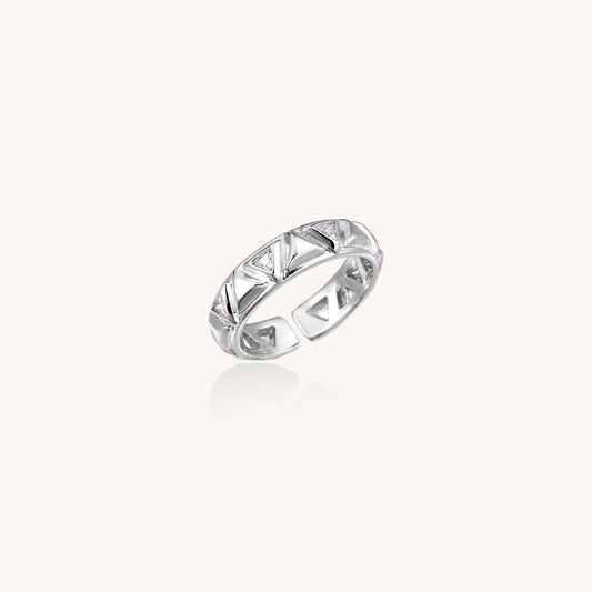 18K gold plated adjustable ring with triangular cutout pattern and sparkling zirconia stones on white background.