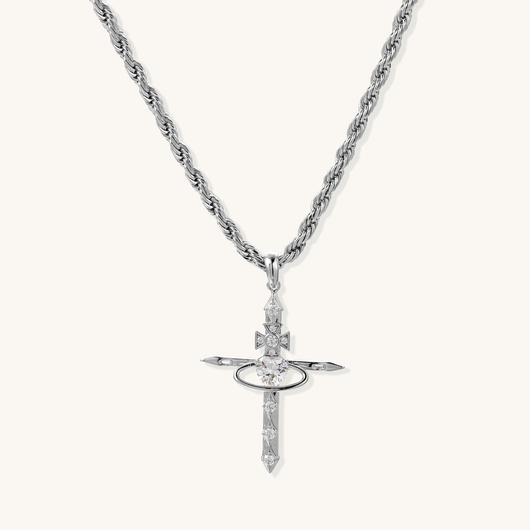 Gold-plated brass statement necklace with celestial cross pendant featuring orbital ring and zirconia stones on rope chain